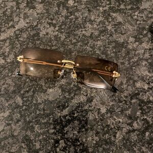 Gold and Black Rimless Sunglasses